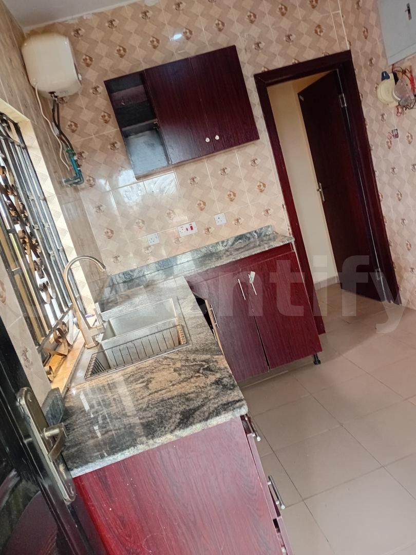 Standard built 2bedroom flat ensuite with 3 toilets, wardrobe, 3 water heaters, ppm, kitchen cabinet, fenced and gated,